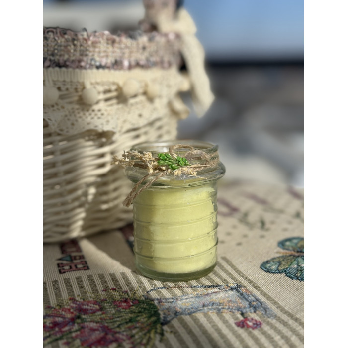 Великодня свічка жовта в скляній баночці з декором середня