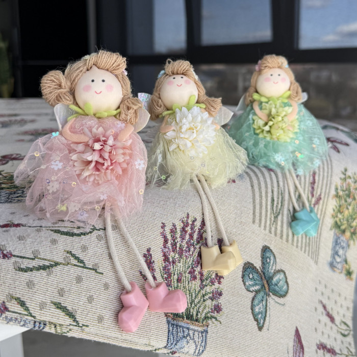 Green decorative Easter doll with flower