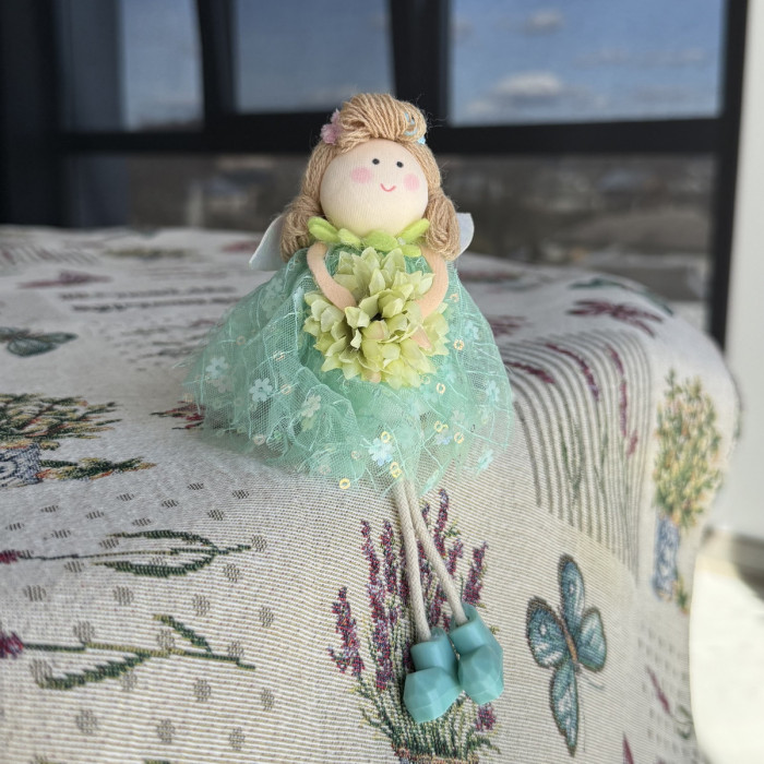 Green decorative Easter doll with flower